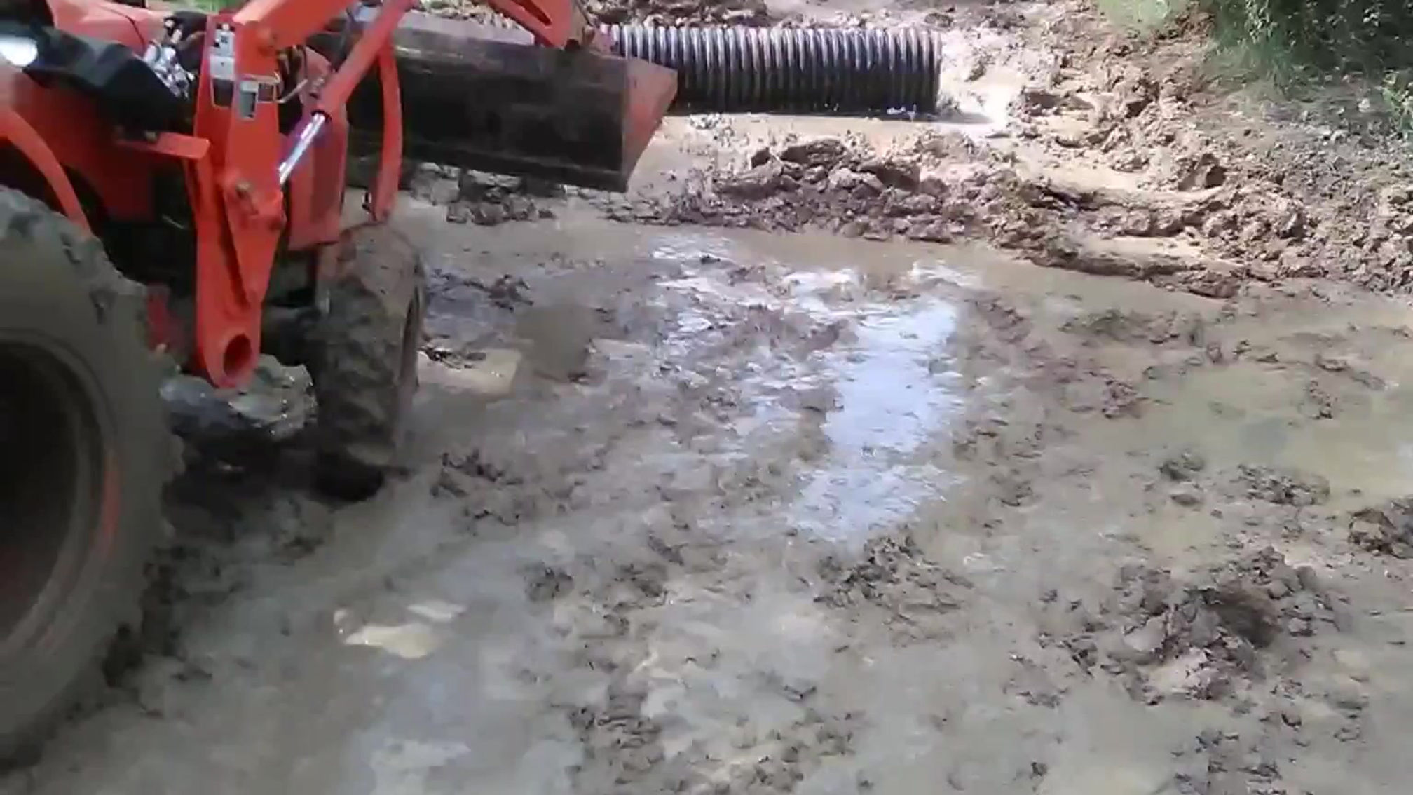 smoothing out roads,  and installing culvert